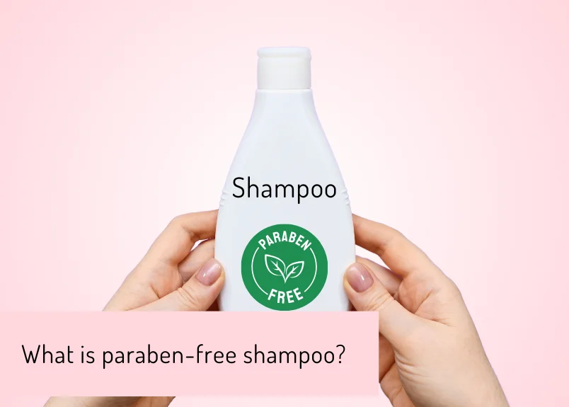 two hands holding a paraben free shampoo bottle defining significance of the shampoo