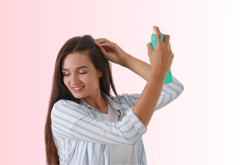 Girl using dry shampoo