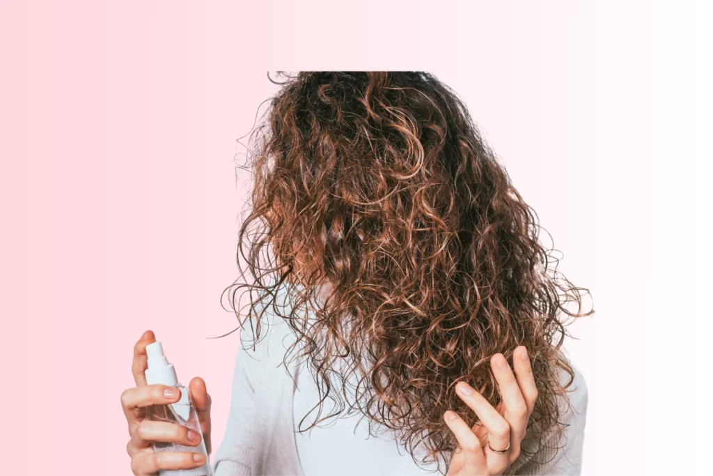 Woman using dry shampoo on her wet hair