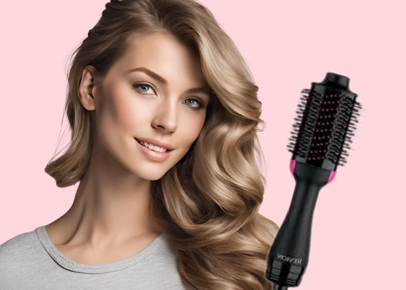 Woman with curled hair and Revlon blow dryer brush