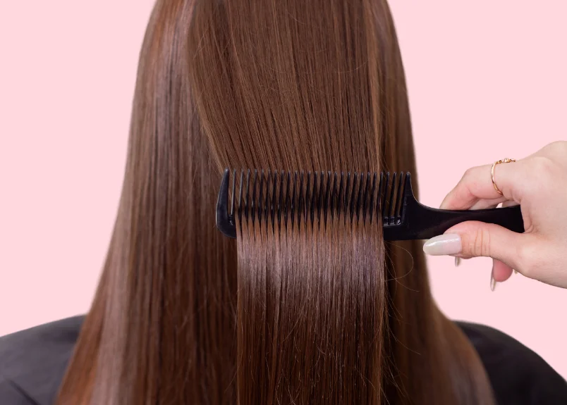 Woman bruhing her hair