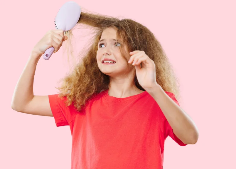 Woman brushing puffy hair