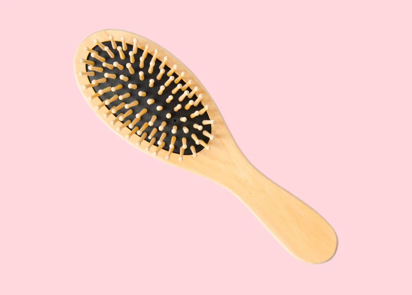 Bamboo hair brush with pink background