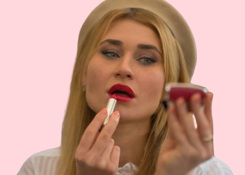 Woman correcting her matte lipstick mistakes