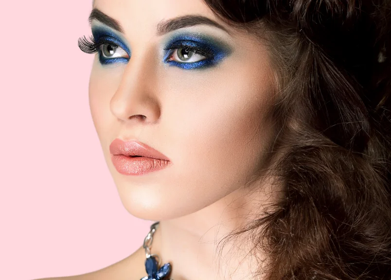 Woman with rosy pink lipstick and blue eyeshadow