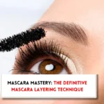 Eye of beautiful woman, mascara wand and text indicating ,how to layer mascara?