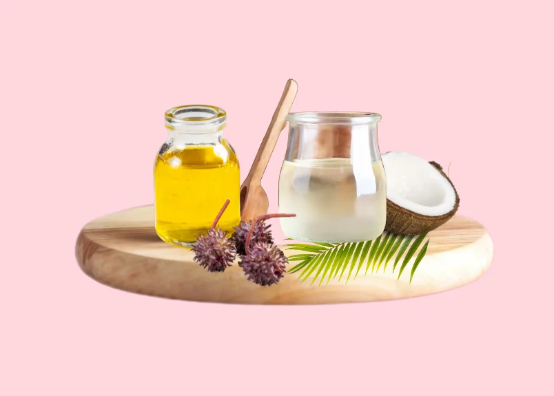 Coconut and Castor Oil, castor fruit, broken half of coconut, coconut leaf, wooden spoon and wooden tray.