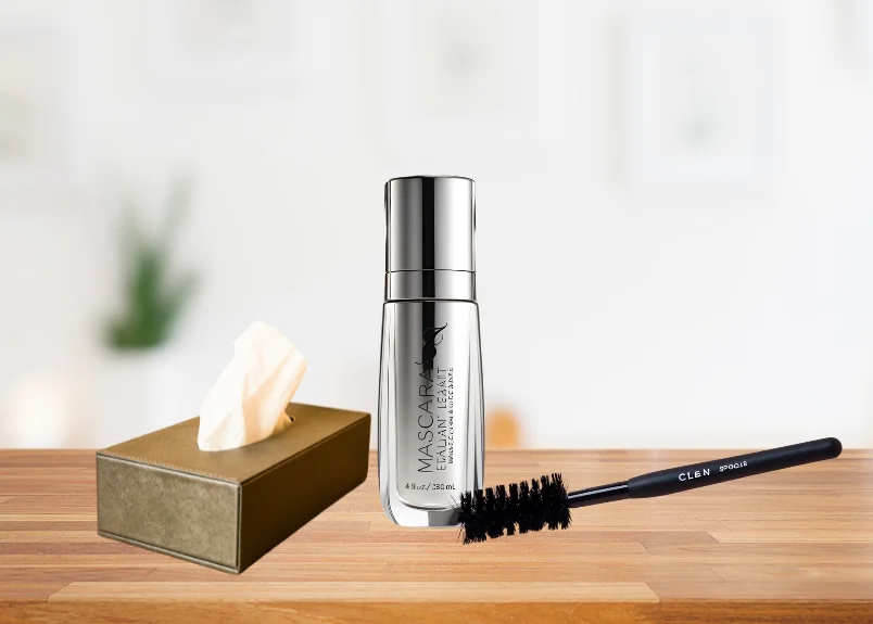 Tissue box, mascara sealant bottle and clean spoolie brush