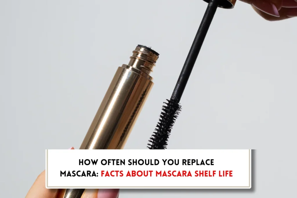 Open mascara bottle with wand ho0lded in hands and text indicating, "How often should you replace your mascara?"