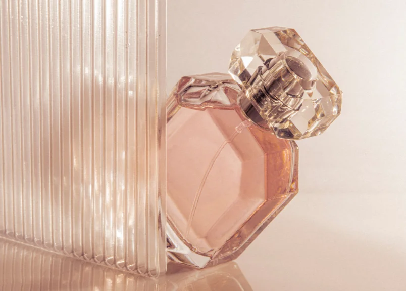 Homemade perfume made with essential oils and glass wall