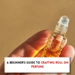 Rollerball perfume bottle, hasnd sand text indicating, "How to make roll on perfume"