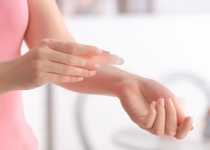 Rollerball perfume application on wrist