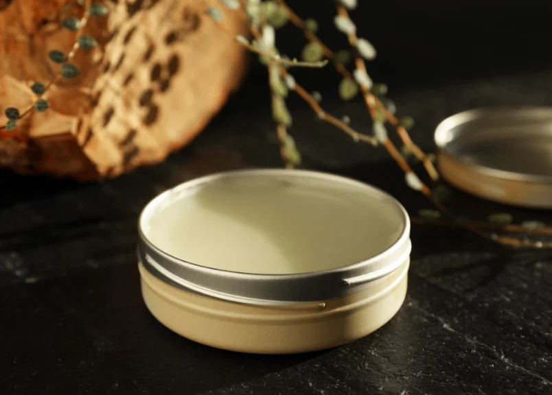 Solid perfume on a b;acl granite platform